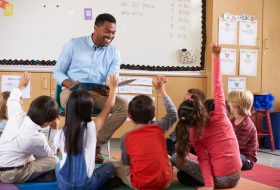 bigstock-Elementary-school-kids-sitting-121205207